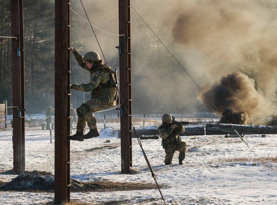 Ukrainian servicemen take part in drills as President Poroshenko visits a military training centre in Chernihiv Region