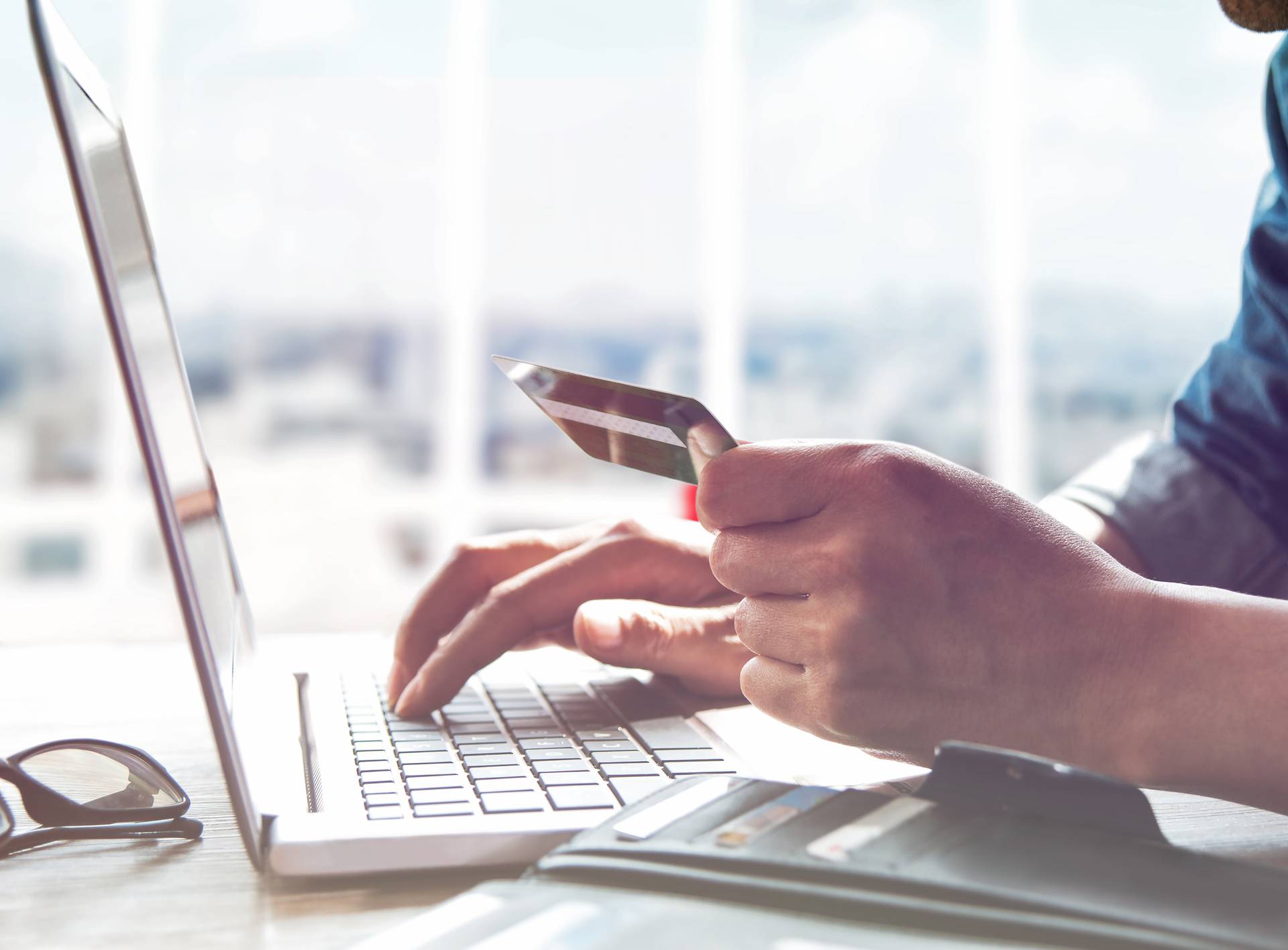 Online shopping.Hands holding credit card and using laptop.