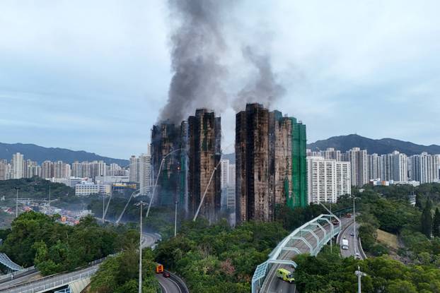 A drone view shows flames and thick smoke rising from Wang Fuk Court housing estate during a major fire, in Tai Po, Hong Kong