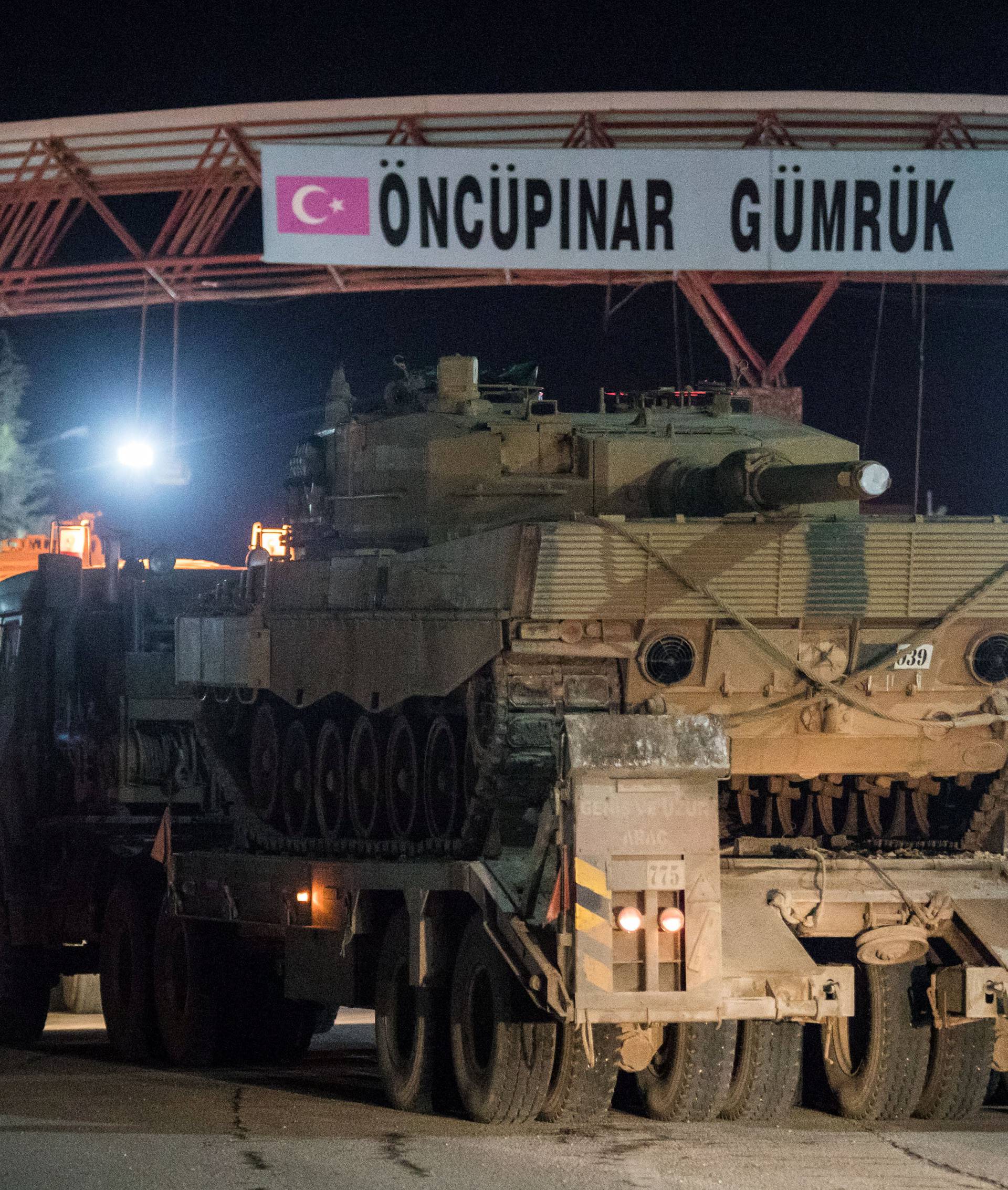 Turkish military vehicles cross into Syria at Oncupinar border gate in Kilis