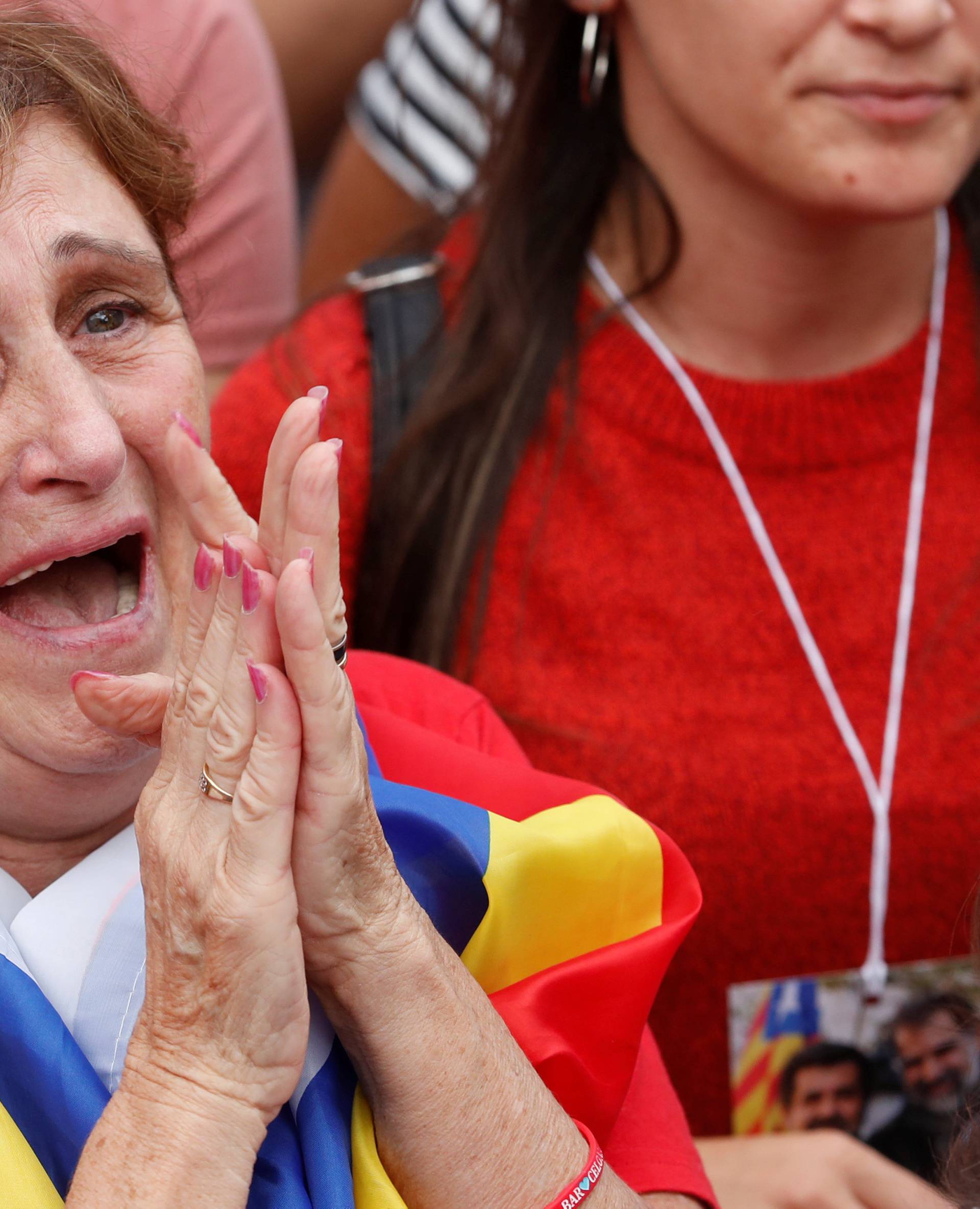 Woman reacts while the Catalan regional parliament votes for independence of Catalonia from Spain in Barcelona
