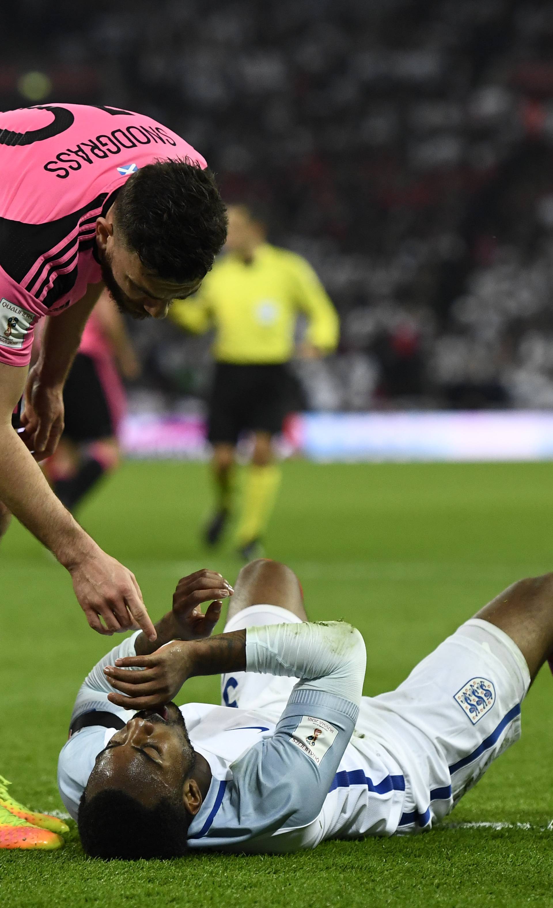 Scotland's Robert Snodgrass gestures towards England's Danny Rose