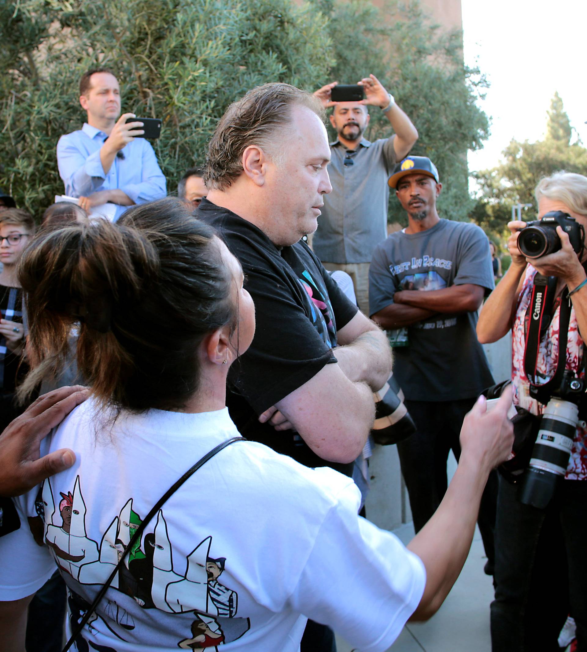 Protesters gather at the El Cajon Police Department headquarters to protest fatal shooting of an unarmed black man Tuesday by officers in El Cajon, California