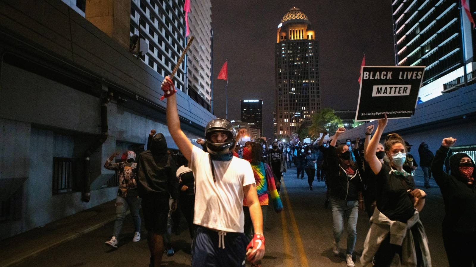 Protestors gather a day after a grand jury decided not to bring homicide charges against police officers involved in the fatal shooting of Breonna Taylor in her apartment, in Louisville