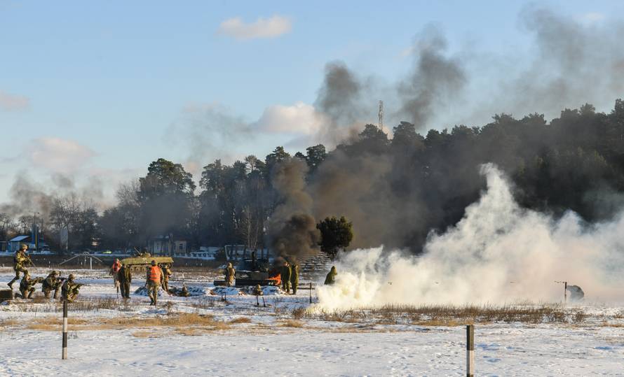 Ukrainian servicemen take part in drills as President Poroshenko visits a military training centre in Chernihiv Region