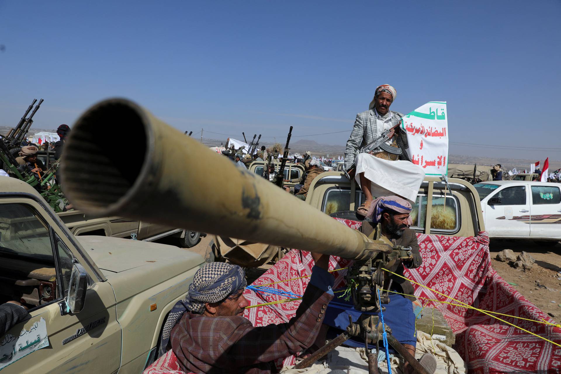 Houthi tribesmen parade to show defiance after U.S. and U.K. air strikes on Houthi positions near Sanaa