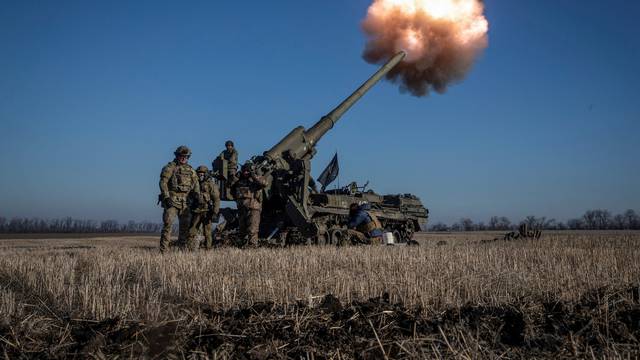 Ukrainian servicemen fire a 2S7 Pion self-propelled gun toward Russian positions on a frontline near Bakhmut