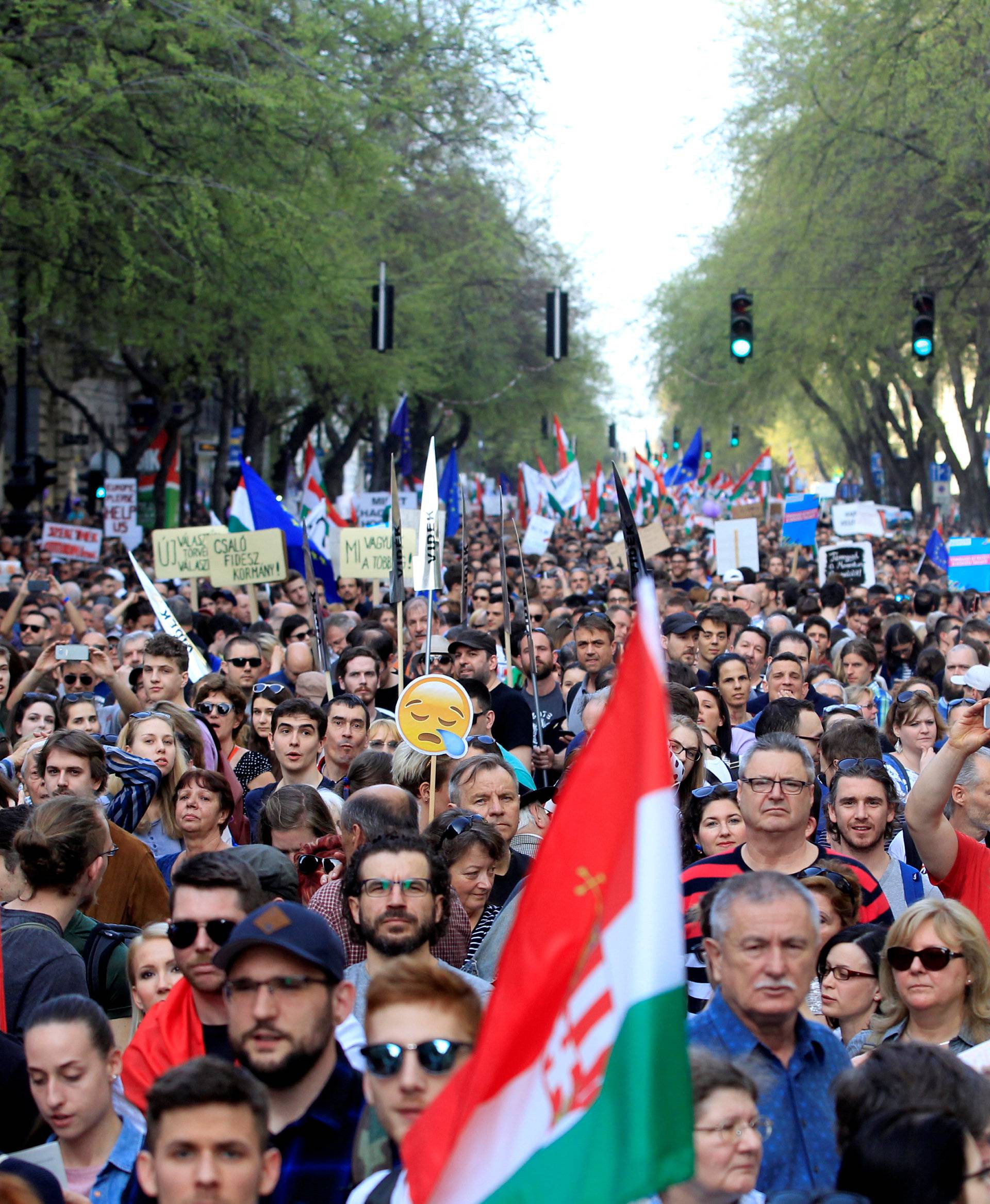 People attend a protest against the government of Prime Minister Viktor Orban in Budapest