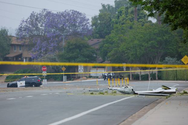 Crash scene after a civilian aircraft went down in a military neighborhood, in San Diego