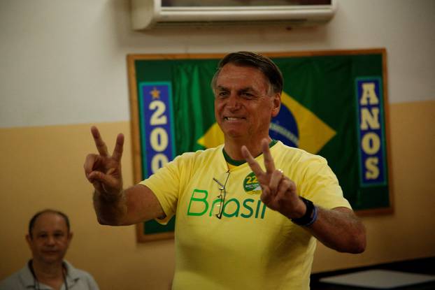 Brazil's President and presidential candidate Jair Bolsonaro gestures as he votes during presidential election run-off, in Rio de Janeiro,