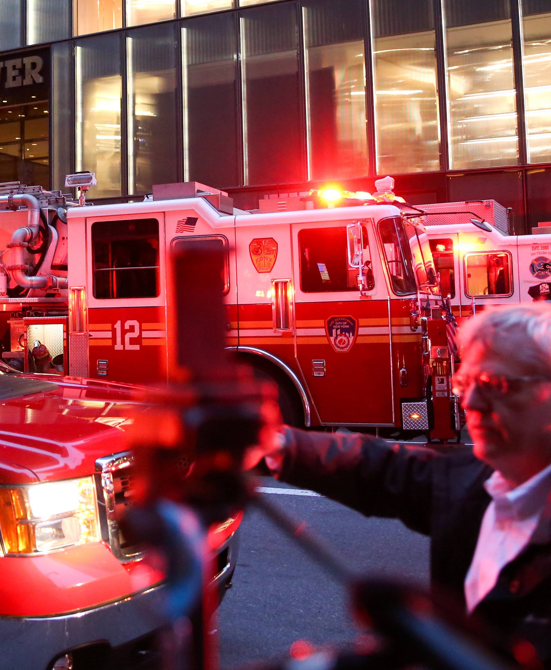 First responders work on a fire in a residential unit at Trump tower in the Manhattan borough of New York City