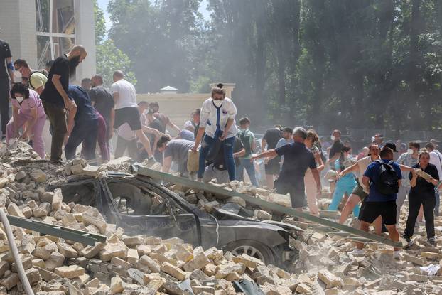 Rescuers work at Ohmatdyt Children's Hospital that was damaged during Russian missile strikes, in Kyiv