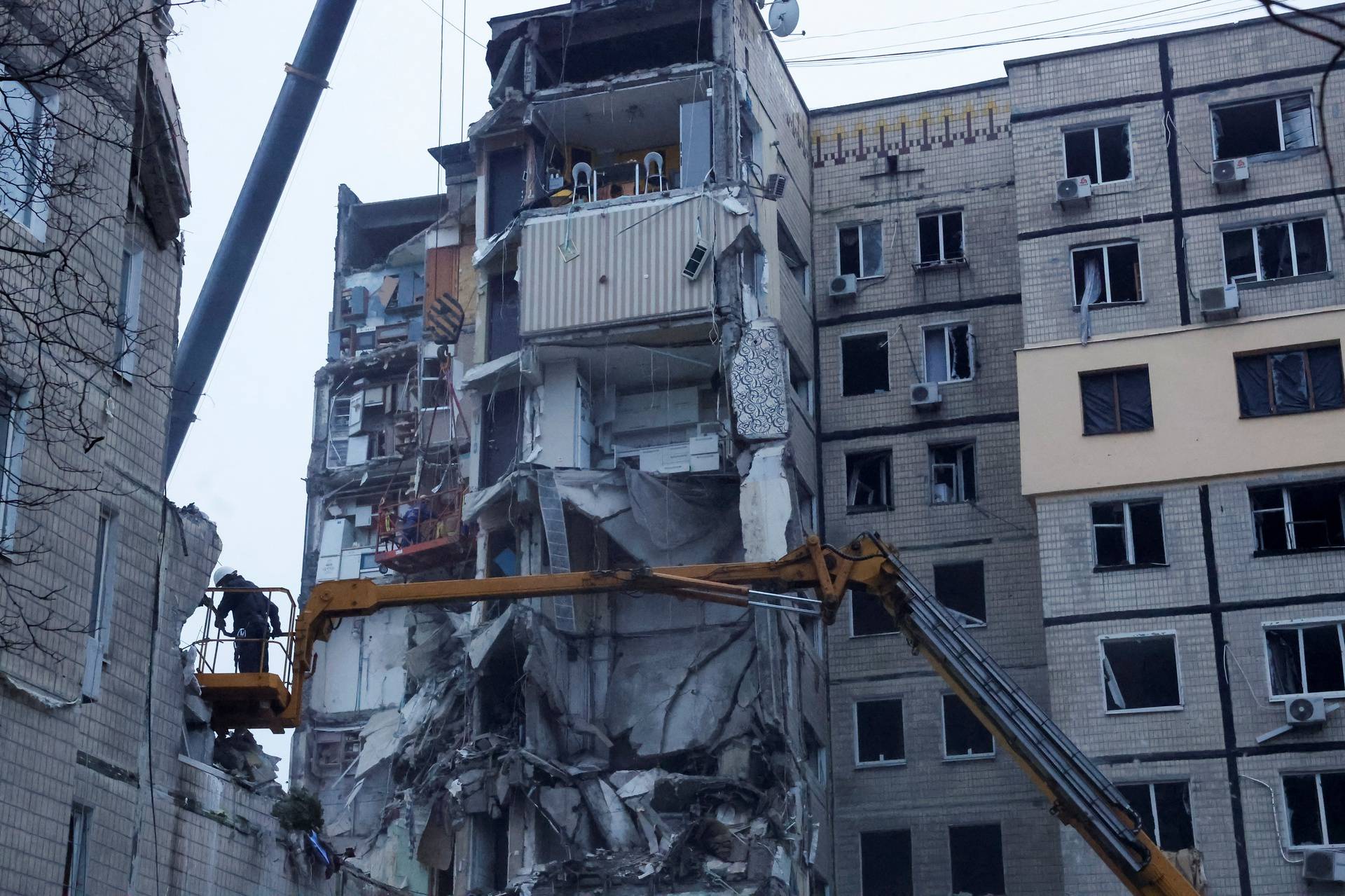 Aftermath of Dnipro apartment block destruction following missile strike