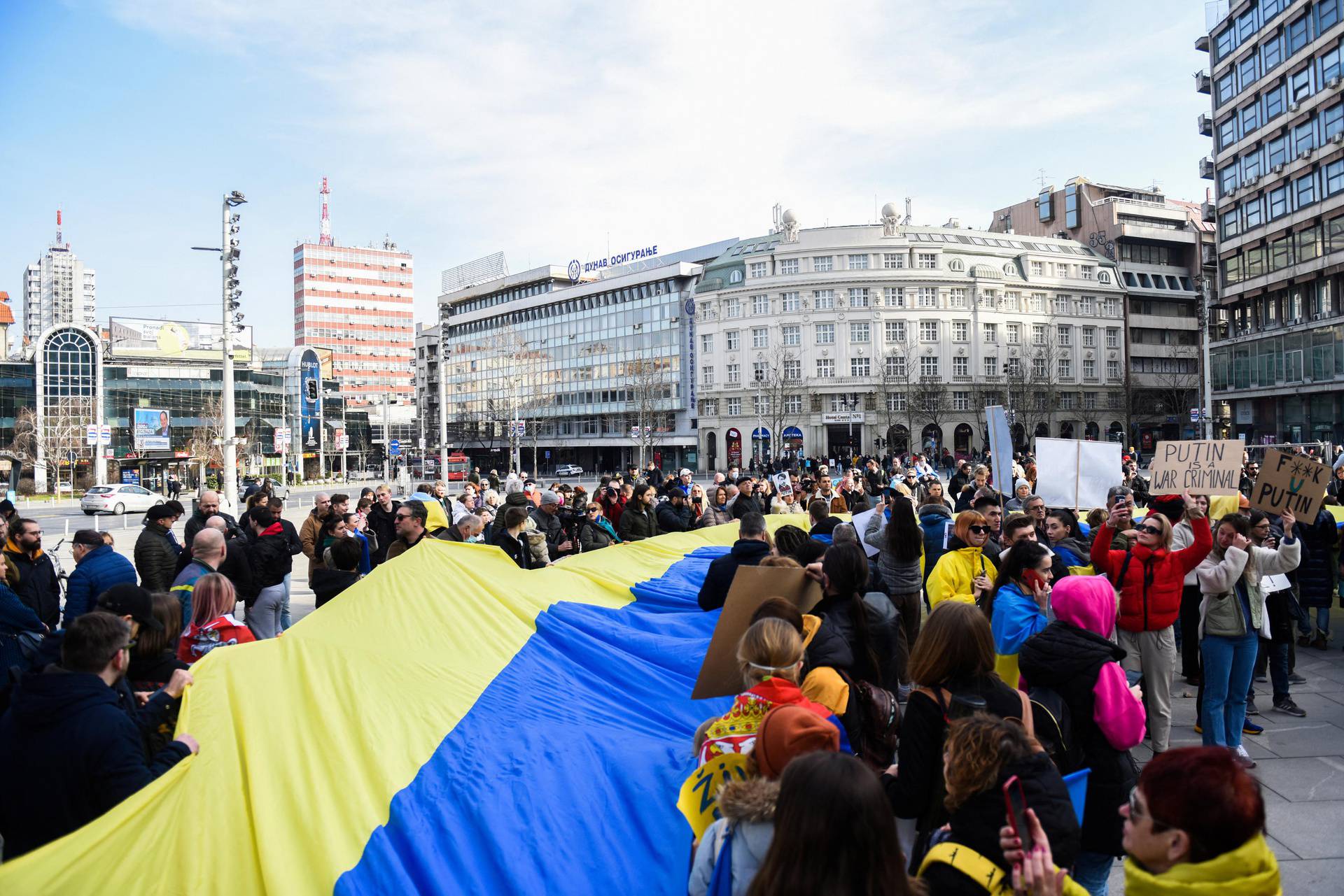 People take part in an anti-war protest, following Russia's invasion of Ukraine, in Belgrade