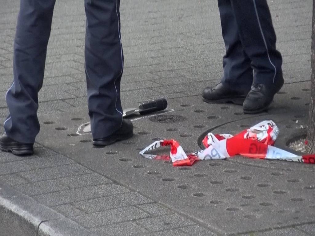 A screen grab taken from video footage shows police arresting a Syrian refugee after he killed a woman with a machete in Reutlingen