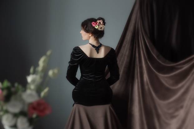 vintage portrait of young beautiful girl in black dress
