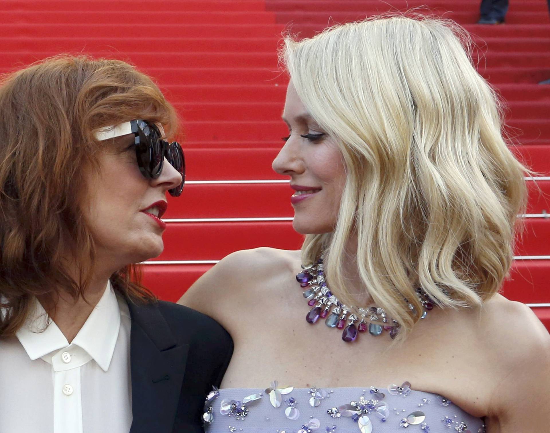 Actresses Susan Sarandon and Naomi Watts pose on the red carpet as they arrive for the opening ceremony and the screening of the film "Cafe Society" out of competition during the 69th Cannes Film Festival in Cannes