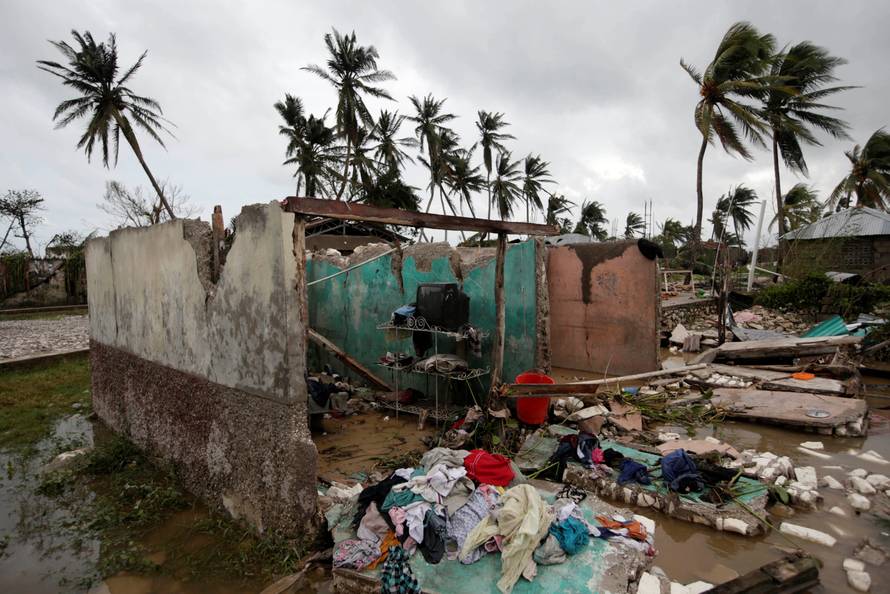 A television is seen in a house destroyed by Hurricane Matthew in Les Cayes