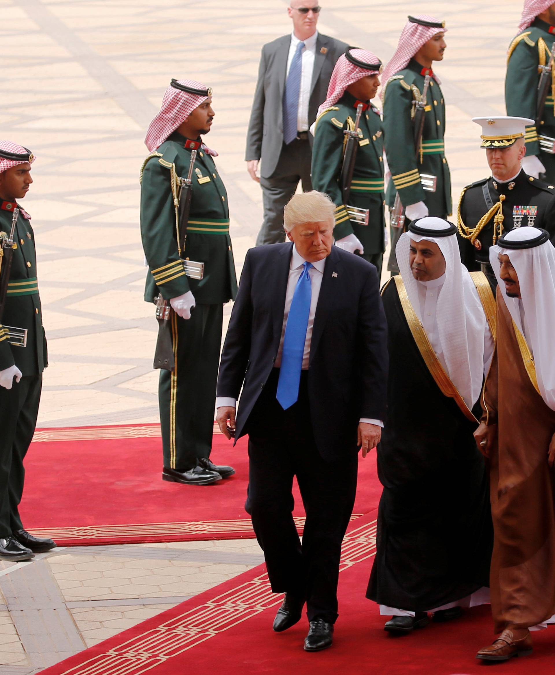 Saudi Arabia's King Salman welcomes Trump and the first lady as they arrive aboard Air Force One at King Khalid Airport in Riyadh