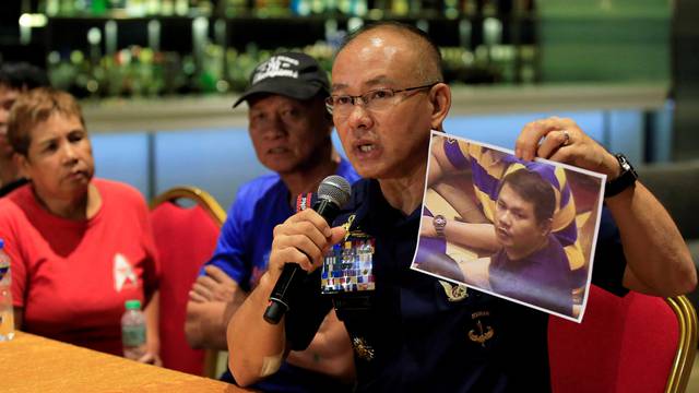 Oscar Albayalde, chief of the capital's police office, shows to journalists a picture of a gunman during a press briefing at a hotel in Pasay city, metro Manila