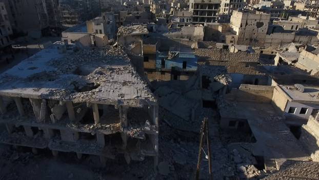 A still image taken on September 27, 2016 from a drone footage obtained by Reuters shows damaged buildings in a rebel-held area of Aleppo