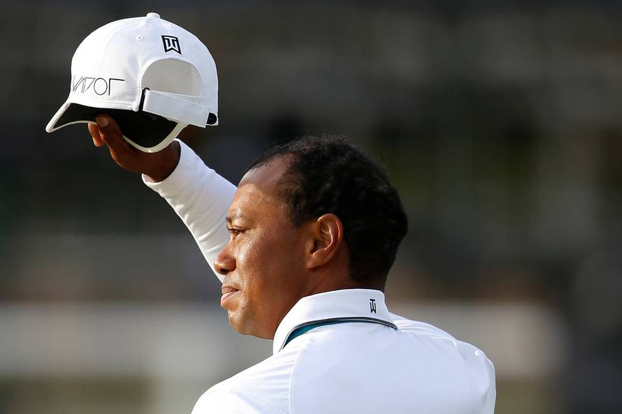 FILE PHOTO: Woods of the U.S. acknowledges the crowd as he walks off the 18th green during the second round of the British Open golf championship on the Old Course in St. Andrews, Scotland