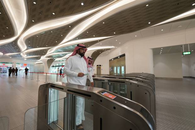 Passengers arrive at the King Abdullah Financial District Metro Station in Riyadh
