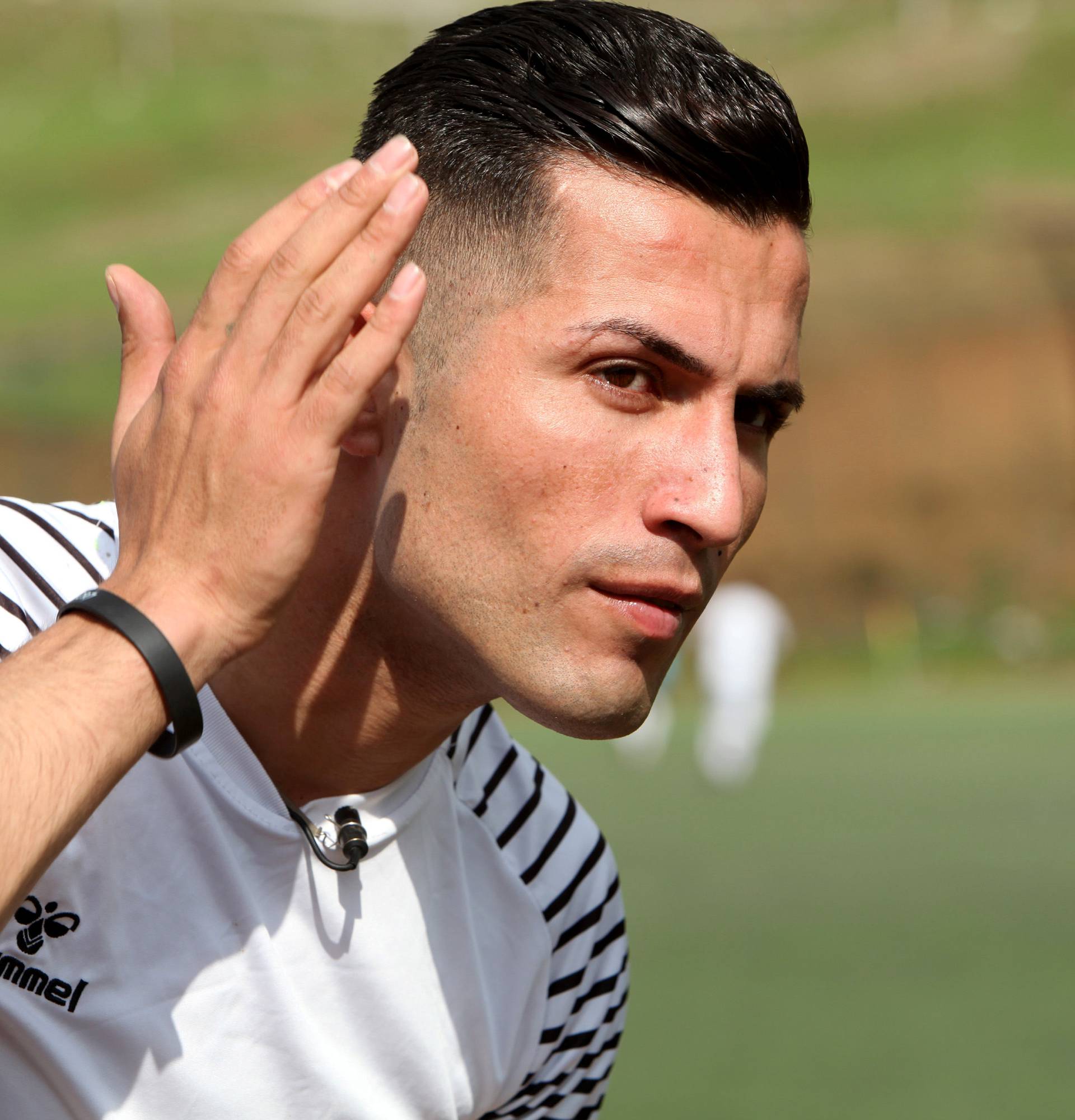 Biwar Abdullah, 25, an Iraqi Kurdish local footballer, who looks like the football player Cristiano Ronaldo, is seen at a football yard in the district of Soran, northeast of Erbil
