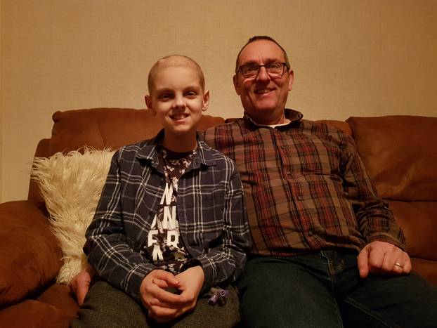 Elliot Smith and his father Bill at home in Yeovil, Somerset. Elliot has been using a robot to remotely access his school lessons whilst recovering from brain cancer Credit: Bill Smith