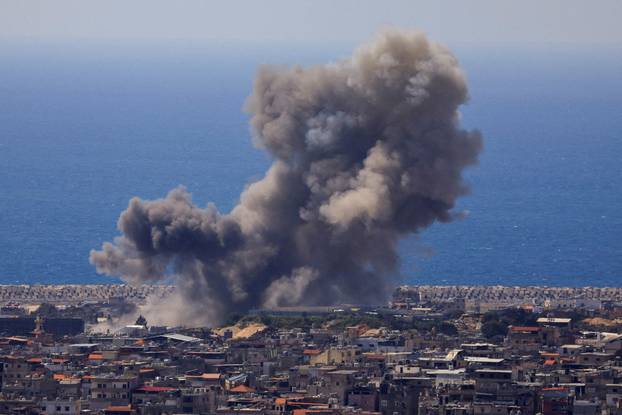 Smoke rises following an Israeli strike on the southern suburbs of Beirut