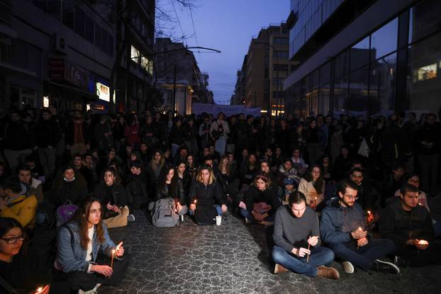 Protesters take part in a demonstration after a train crash near the city of Larissa, in Athens