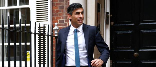 FILE PHOTO: Conservative leadership candidate Rishi Sunak leaves an office building in London