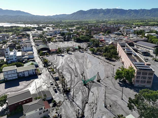 A drone view shows mud covering areas of Hualien