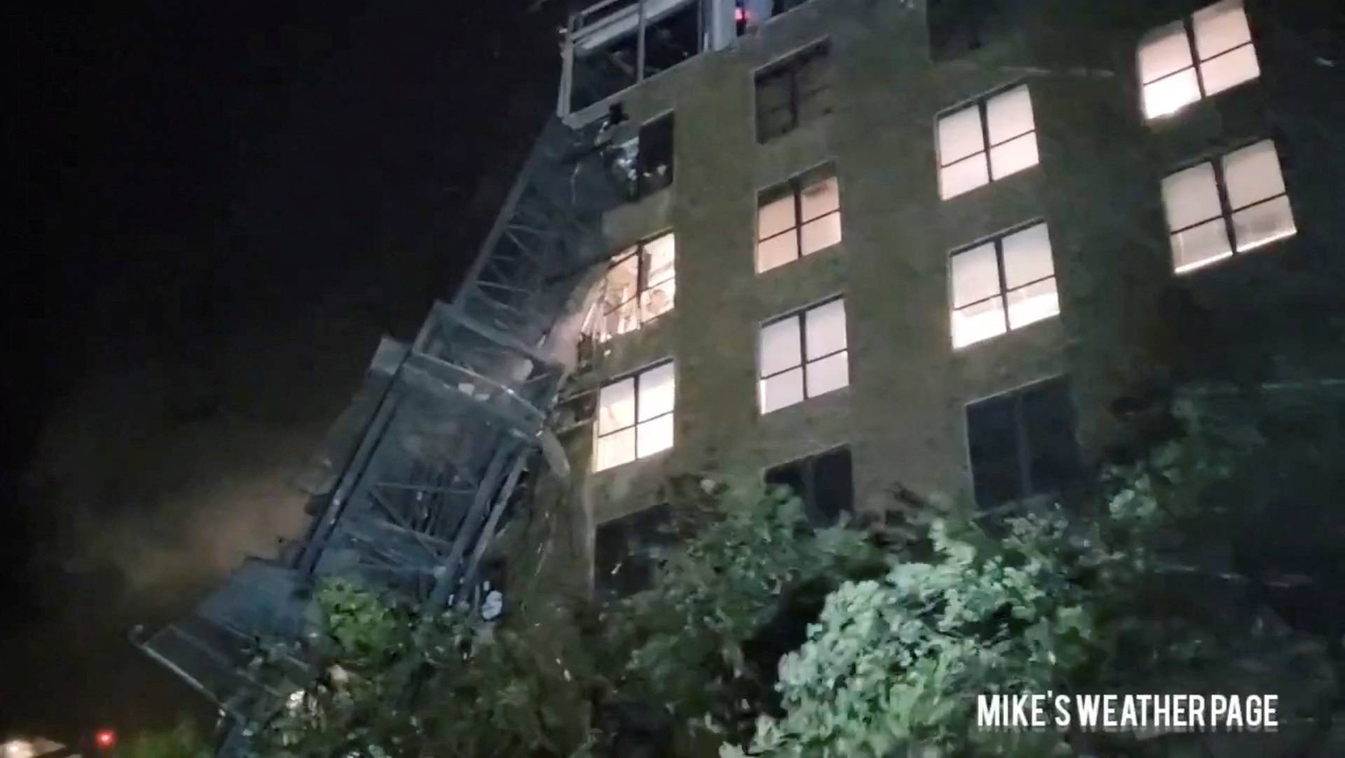 A crane collapses, during heavy rainfall and strong winds caused by Hurricane Milton, in St. Petersburg