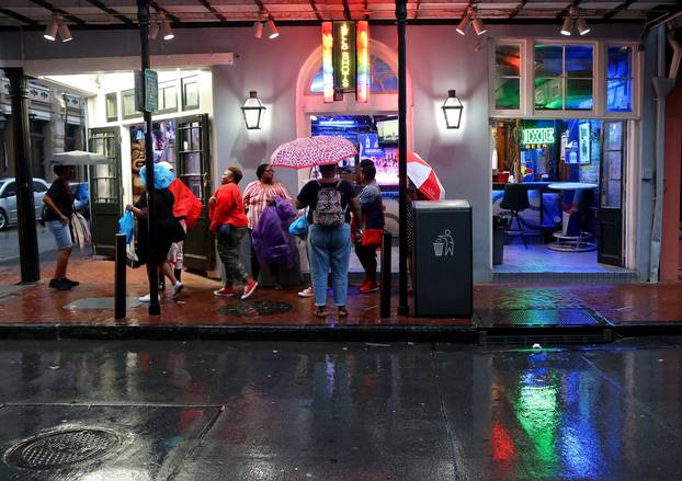Tourists gather on Bourbon St. during Hurricane Barry in New Orleans
