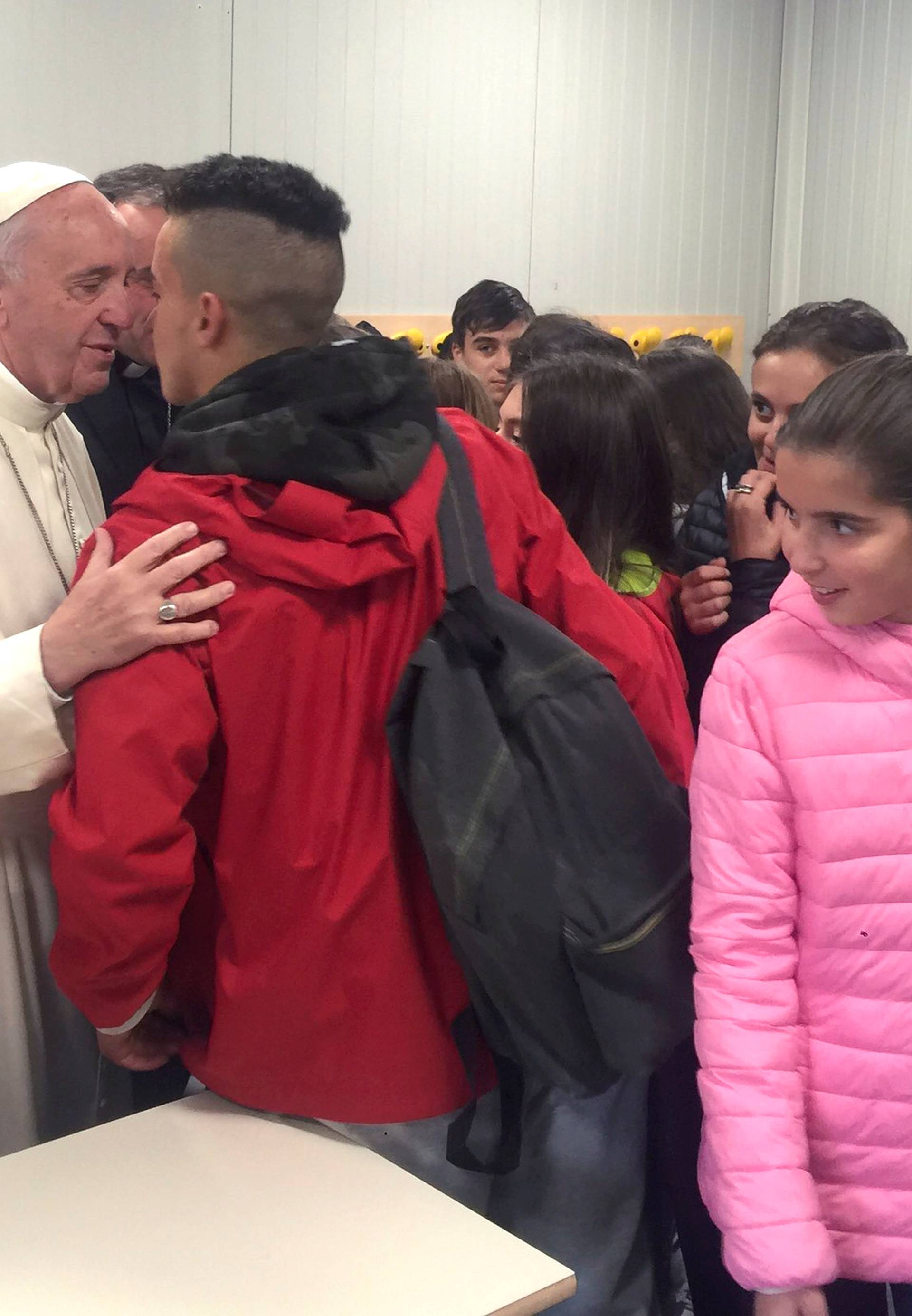 Pope Francis greets pupils in a school in Amatrice