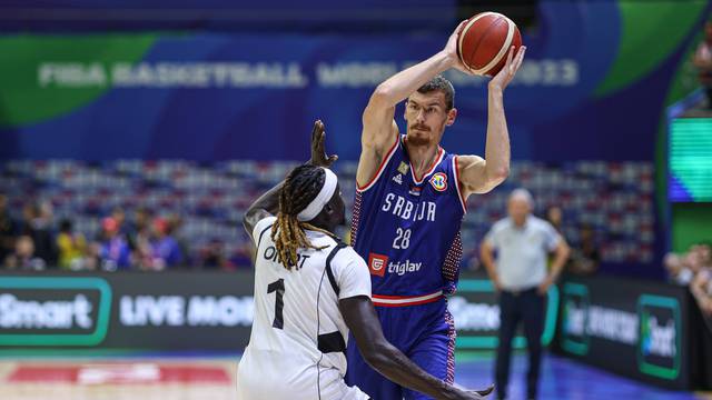 MANILA, PHILIPPINES - AUGUST 30: Borisa Simanic 28 of Serbia drives the ball against Nuni Omot 1 of South Sudan during t