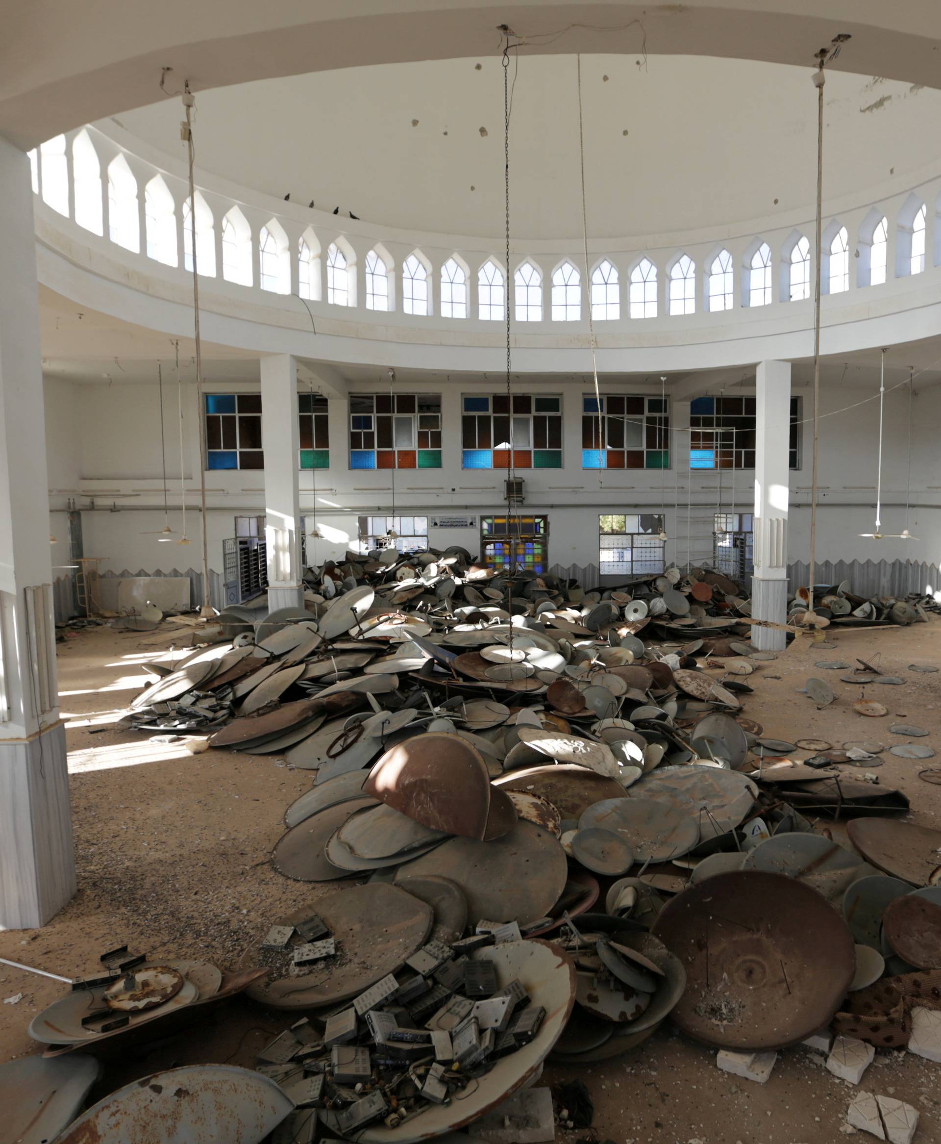 Satellite dishes damaged by Islamic State militants are pictured inside a mosque in Turkman Bareh village, after rebel fighters advanced in the area, in northern Aleppo Governorate