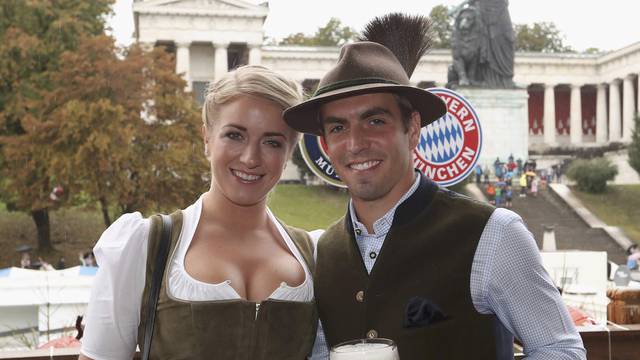 Mueller of Bayern Munich and his wife Lisa pose during their visit at the Oktoberfest in Munich