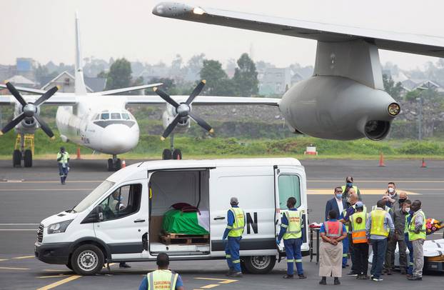 FILE PHOTO: Officials prepare to load the bodies of the slain Italian ambassador to Democratic Republic of Congo Luca Attanasio and his Italian security Vittorio Iacovacci, at the Goma International Airport