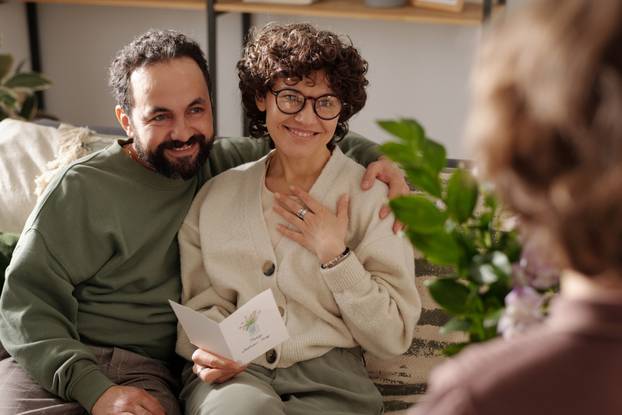 Happy couple looking at their son