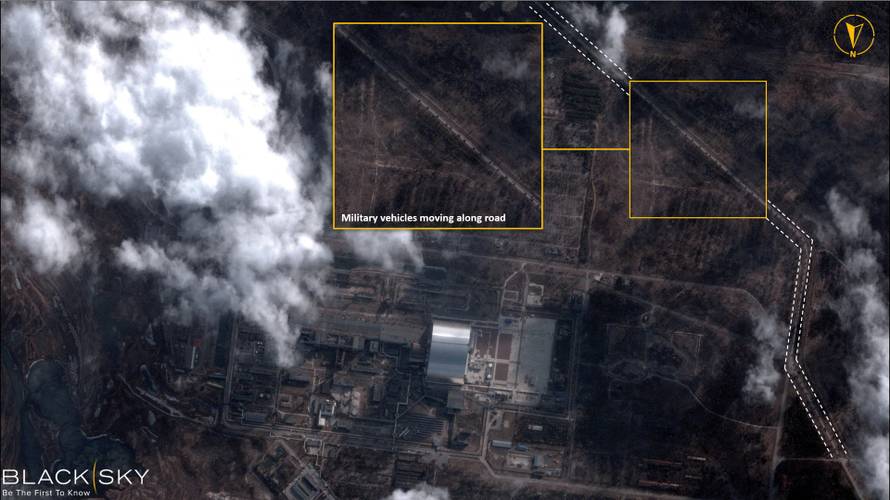 A satellite image with overlaid graphics shows military vehicles alongside Chernobyl Nuclear Power Plant, in Chernobyl