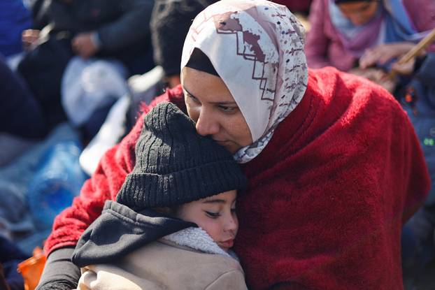 Displaced Palestinians wait to be allowed to return to their homes in northern Gaza, in the central Gaza Strip