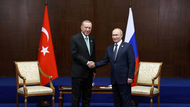 FILE PHOTO: Russia's President Vladimir Putin and Turkey's President Erdogan meet on the sidelines CICA summit in Astana