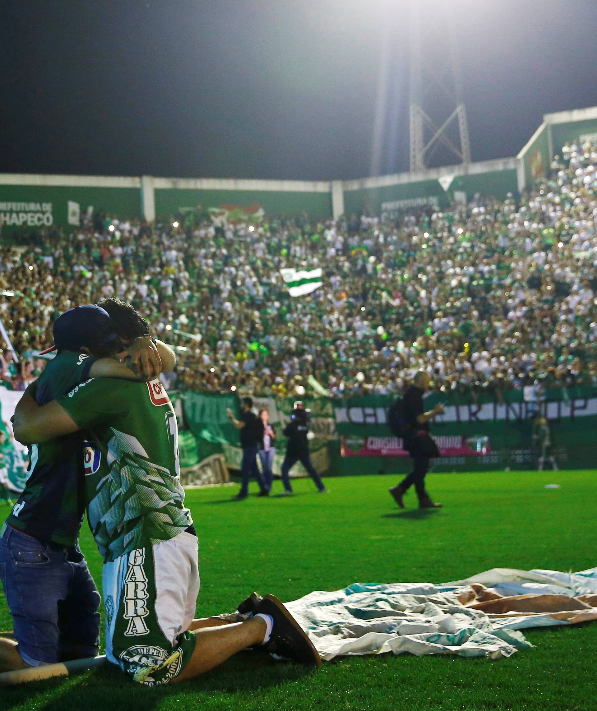Fans of Chapecoense soccer team pay tribute to Chapecoense's players at the Arena Conda stadium in Chapeco