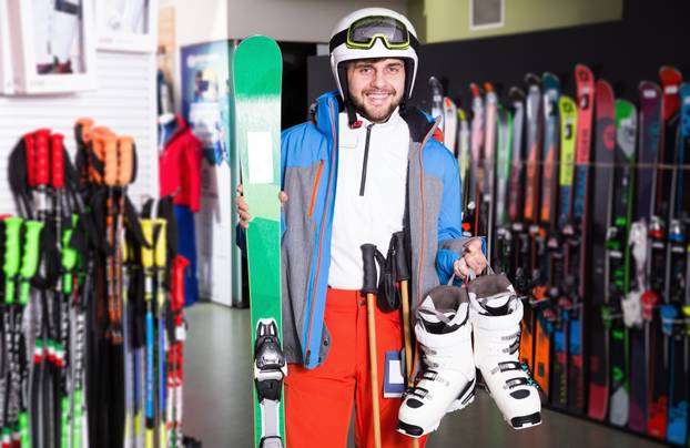 Cheerful,Young,Male,Posing,In,Skiing,Gear,During,Shopping,In