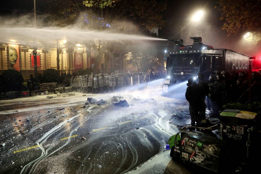 Supporters of Georgia's opposition attend a rally to protest, after government halts EU application until 2028, in Tbilisi