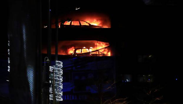 Cars are seen on fire during a serious blaze in a multi-storey car park in Liverpool, Britain.