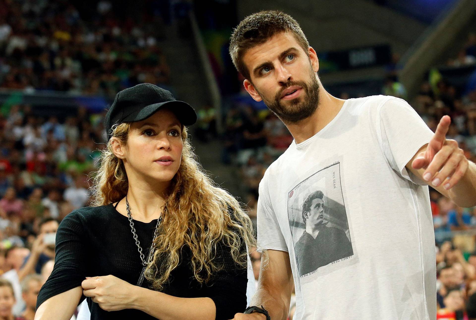 FILE PHOTO: Colombian singer Shakira and her partner, Barcelona soccer player Pique, attend the Basketball World Cup quarter-final game between the U.S. and Slovenia in Barcelona