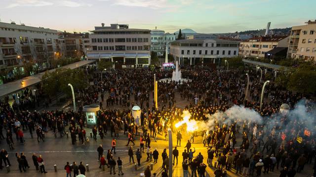 Protestants light flares as they arrive on civic protest in Podgorica